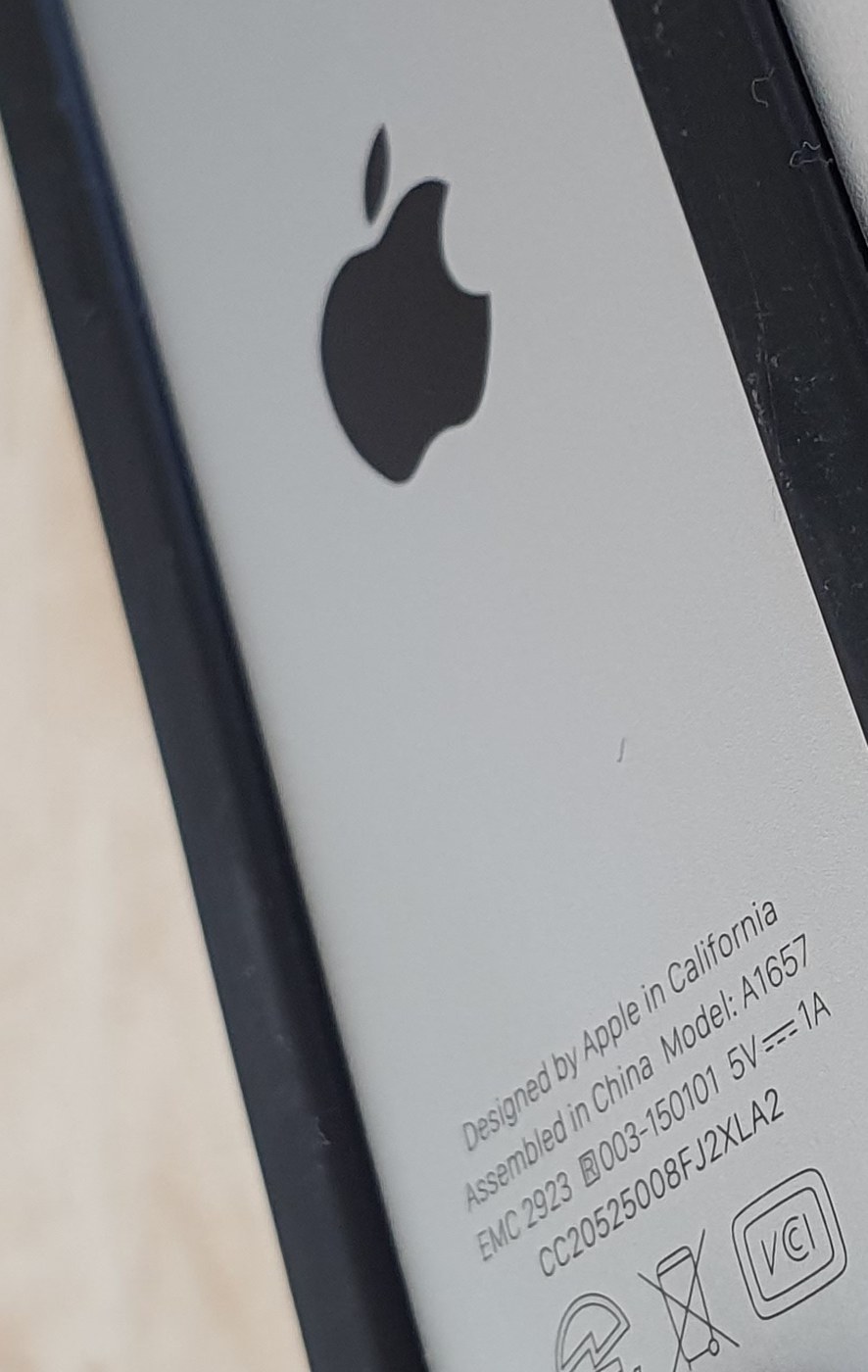 Close-up of the etched text on the bottom of a Magic Mouse v2, reading Model: A1657.