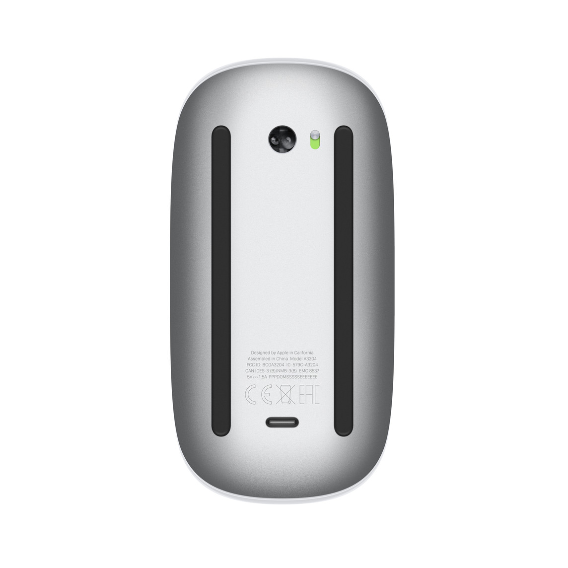 Underside of the 2024 Magic Mouse. There is no battery door. A small oval USB-C port sits on the bottom edge between the two skid strips, and the etched text reads Model A3204.
